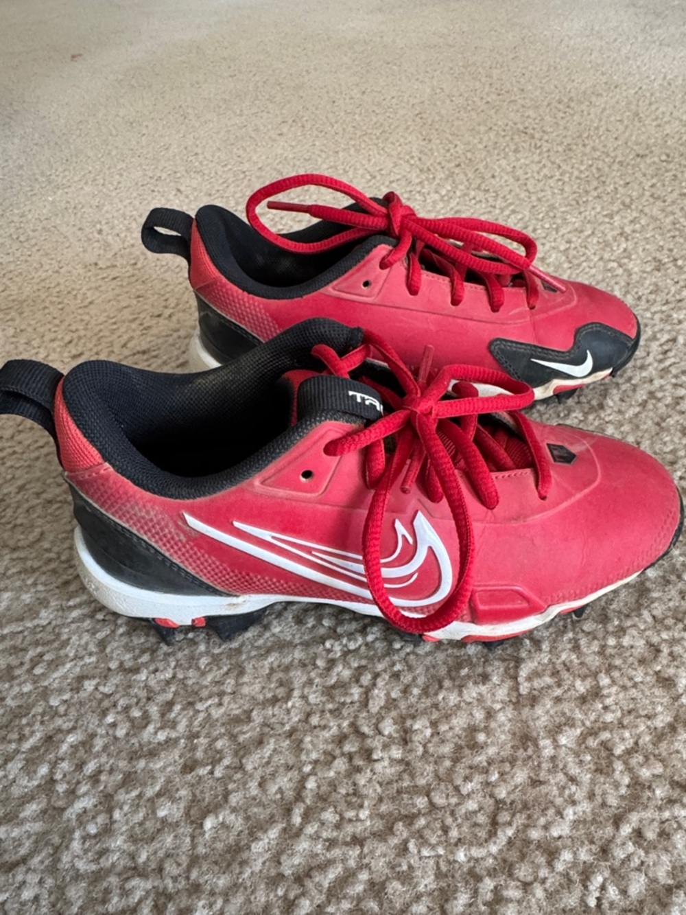 Nike Kids Red and Black Baseball Cleats with White Swoosh